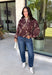 Make your fall layers a little more interesting with this deep burgundy jacket from Entro. A unique mix of stripes and neutral floral prints brings together rich autumn shades for a look that stands out while still being easy to style. The collared neckline and zipper-front closure give it a classic jacket feel, while the bubble hem adds shape and a fun, modern finish. Made from 100% cotton, it’s a great lightweight layer for those in-between fall days when you need just a little something extra. 