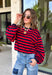 Classic stripes never go out of style, and this cozy knit top from Hyfve is the perfect addition to your fall wardrobe. Featuring bold red and navy stripes, this timeless top offers a relaxed silhouette that's easy to dress up or down. Ribbed detailing at the neckline, cuffs, and hem gives it a polished finish, while the soft fabric keeps you warm and comfortable all day long. 