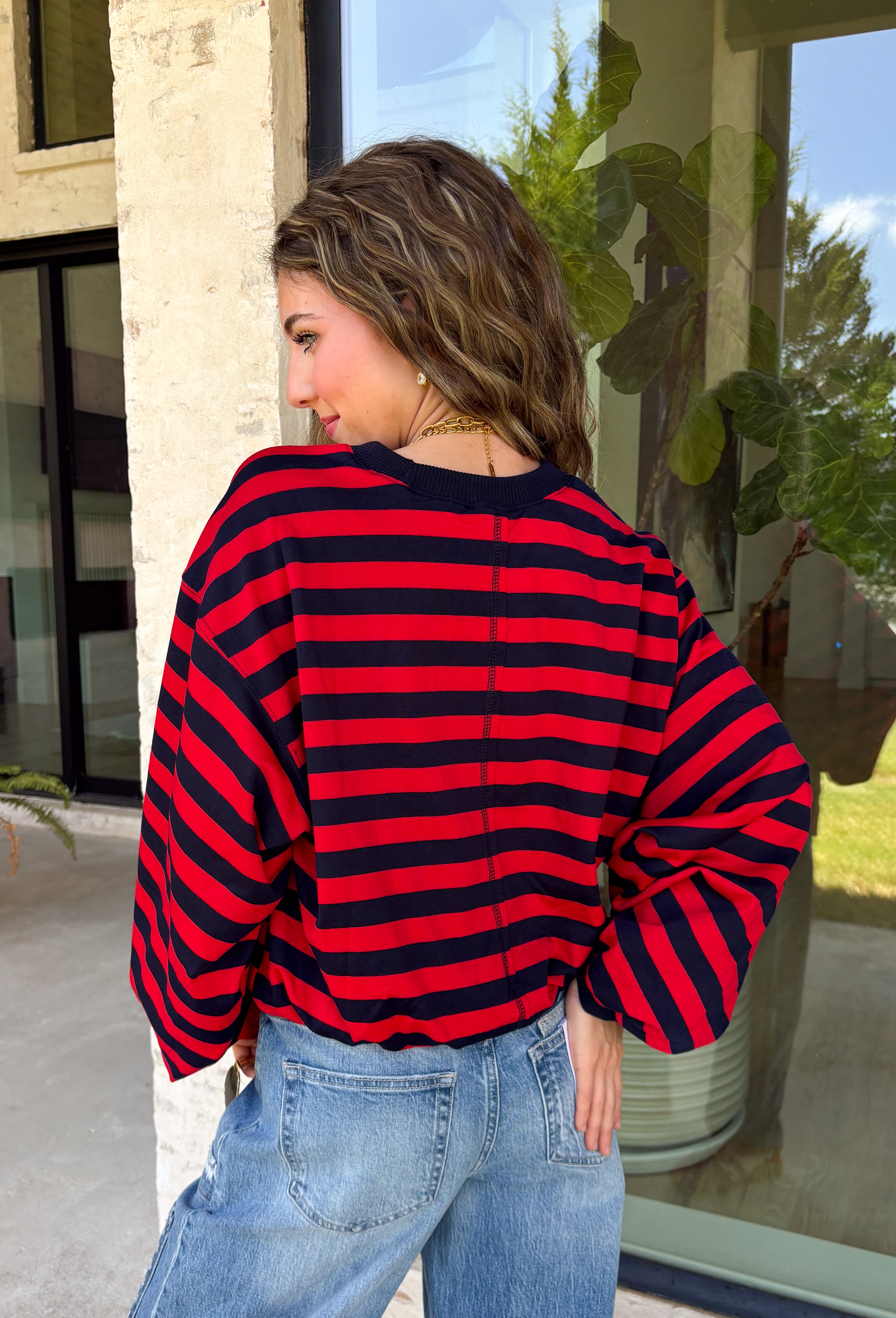 Classic stripes never go out of style, and this cozy knit top from Hyfve is the perfect addition to your fall wardrobe. Featuring bold red and navy stripes, this timeless top offers a relaxed silhouette that's easy to dress up or down. Ribbed detailing at the neckline, cuffs, and hem gives it a polished finish, while the soft fabric keeps you warm and comfortable all day long. 