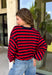 Classic stripes never go out of style, and this cozy knit top from Hyfve is the perfect addition to your fall wardrobe. Featuring bold red and navy stripes, this timeless top offers a relaxed silhouette that's easy to dress up or down. Ribbed detailing at the neckline, cuffs, and hem gives it a polished finish, while the soft fabric keeps you warm and comfortable all day long. 