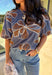 Effortlessly charming, this blue puff sleeve top by Voy is a fall favorite with a touch of whimsy. Designed with an oversized rust and white embroidered floral pattern throughout, it brings texture and color to your everyday look. The short puff sleeves and lettuce hem add a feminine finish, while the soft linen-blend fabric keeps it lightweight and breathable. Perfect for pairing with denim or skirts all season long.