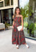 Celebrate the beauty of the season in this effortlessly feminine midi dress from Entro. Designed with a rich brown backdrop and a gorgeous floral print in warm fall-inspired shades, this timeless dress is perfect for any fall special occasion. The straight neckline and beautifully pleated bodice create an elegant, flattering silhouette, while the smocked back offers a comfortable, flexible fit. 