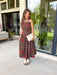 Celebrate the beauty of the season in this effortlessly feminine midi dress from Entro. Designed with a rich brown backdrop and a gorgeous floral print in warm fall-inspired shades, this timeless dress is perfect for any fall special occasion. The straight neckline and beautifully pleated bodice create an elegant, flattering silhouette, while the smocked back offers a comfortable, flexible fit. 