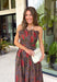 Celebrate the beauty of the season in this effortlessly feminine midi dress from Entro. Designed with a rich brown backdrop and a gorgeous floral print in warm fall-inspired shades, this timeless dress is perfect for any fall special occasion. The straight neckline and beautifully pleated bodice create an elegant, flattering silhouette, while the smocked back offers a comfortable, flexible fit. 