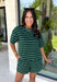 Comfort meets effortless style in this hunter green striped tee. Featuring a timeless white stripe print, this soft tee is the perfect piece to take you from laid-back weekends to busy weekdays with ease. Wear it with the matching shorts for a coordinated set that's equal parts cozy and stylish, or mix and match it with your favorite denim, or leggings, for endless outfit options. 