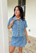 This medium wash button down denim top is one of those pieces you’ll keep reaching for all spring long! Made from 100% cotton, it’s lightweight, breathable, and perfect for layering or wearing on its own. The classic collared neckline and front pockets give it that timeless, easygoing feel, while the medium wash makes it endlessly versatile. Pair it with the matching skort for a matching set, or throw it on with white denim, skirts, —it’s the ultimate grab-and-go staple for busy days.