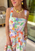 Say hello to your new one-and-done spring outfit! This white jumpsuit is covered in the prettiest colorful floral print with pops of green, orange, purple, pink, and yellow—basically sunshine in clothing form. The square neckline gives it a clean, flattering shape, while the smocked back keeps it comfy and flexible. Finished with side pockets (yes please), a side zipper for easy on-and-off, and adjustable ties at the waist and ankles, this piece is made for everything from weekend plans to vacation days.