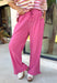 A playful pink palette gives these pants from Twentifourth plenty of personality while still keeping them easy to style. The subtle monochromatic polka dot print adds a fun touch of texture without overpowering the look, while the ruffle hem gives the relaxed silhouette a sweet finishing detail. An elastic waistband with a drawstring keeps them comfortable for all-day wear, and side and back pockets add everyday function. 