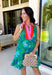 Fresh, vibrant, and made for sunny days, this sleeveless green dress is blooming with a beautiful blue floral print that instantly brightens your look. The pink and tomato red contrast trim along the collared neckline and along the front adds a playful pop of color that makes this piece feel extra special. It’s the kind of dress you’ll reach for when you want something easy, flattering, and full of personality.