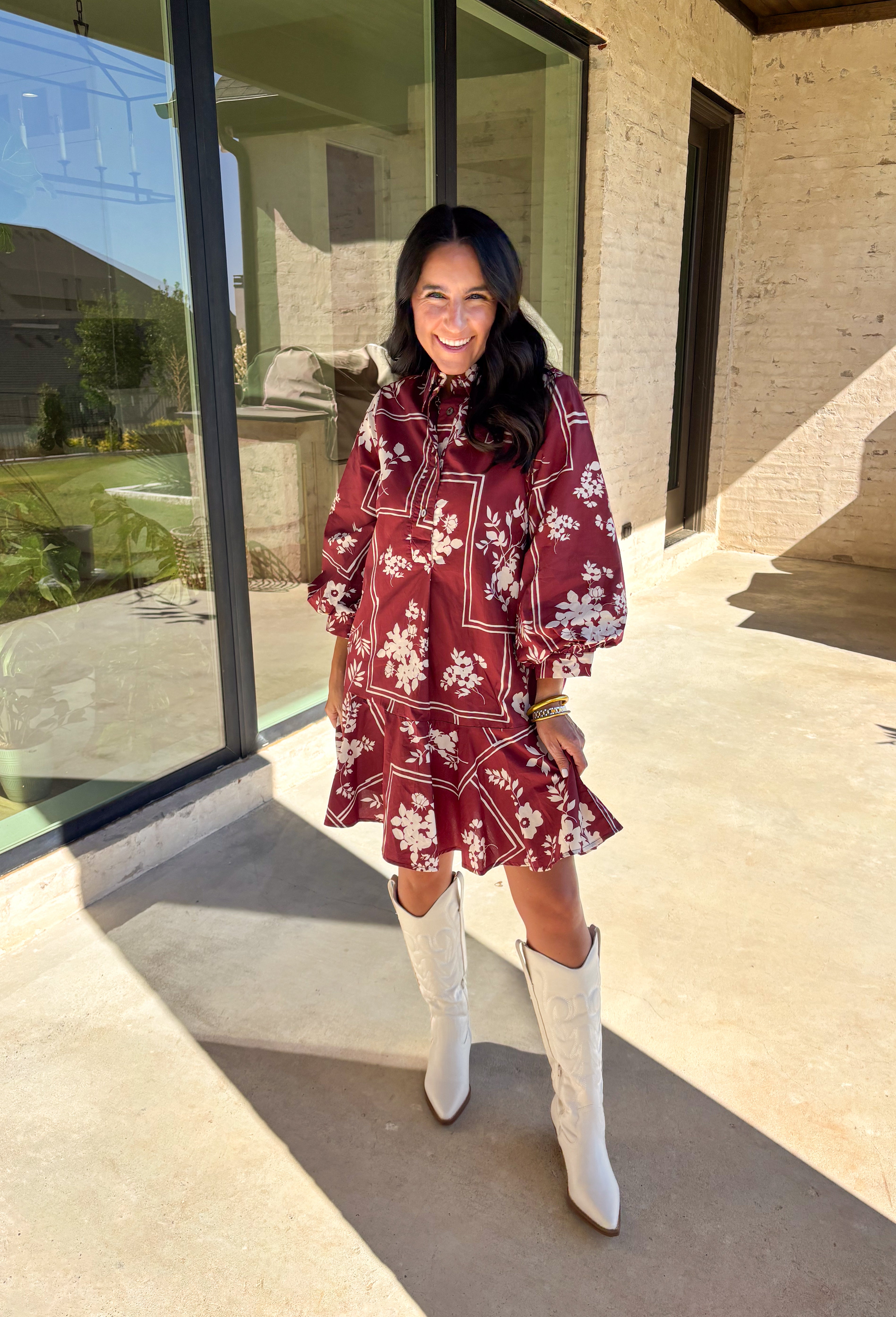 Effortless and feminine, this brick red dress is blooming with white botanical florals for a timeless autumn look. Featuring ¾ sleeves and a button-front closure, it blends comfort with charm. Side pockets add a touch of practicality, while the ruffle-free silhouette keeps it simple and chic. Fully lined and made from breathable cotton, this is the kind of dress you’ll love to style for everyday wear or seasonal gatherings.