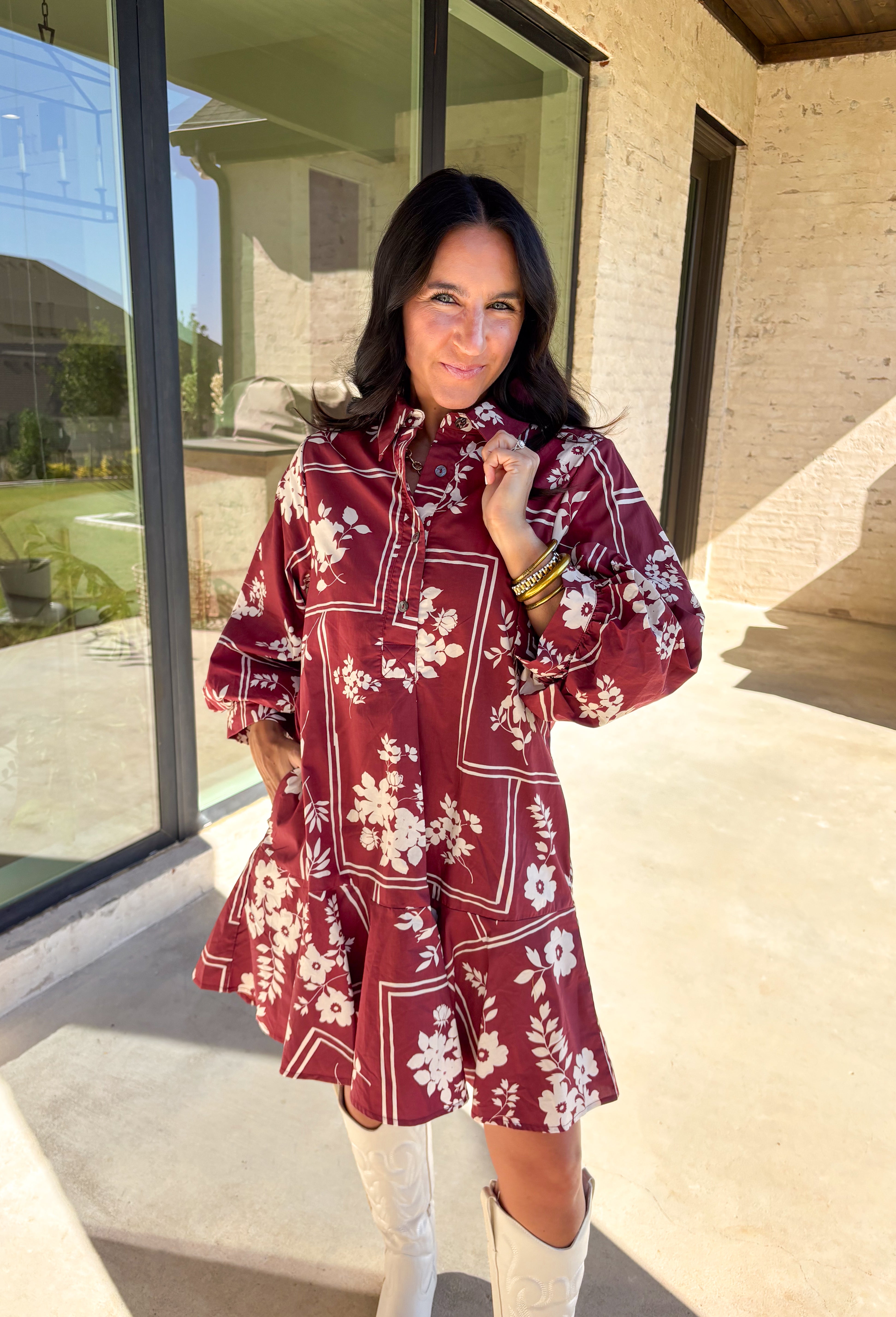 Effortless and feminine, this brick red dress is blooming with white botanical florals for a timeless autumn look. Featuring ¾ sleeves and a button-front closure, it blends comfort with charm. Side pockets add a touch of practicality, while the ruffle-free silhouette keeps it simple and chic. Fully lined and made from breathable cotton, this is the kind of dress you’ll love to style for everyday wear or seasonal gatherings.