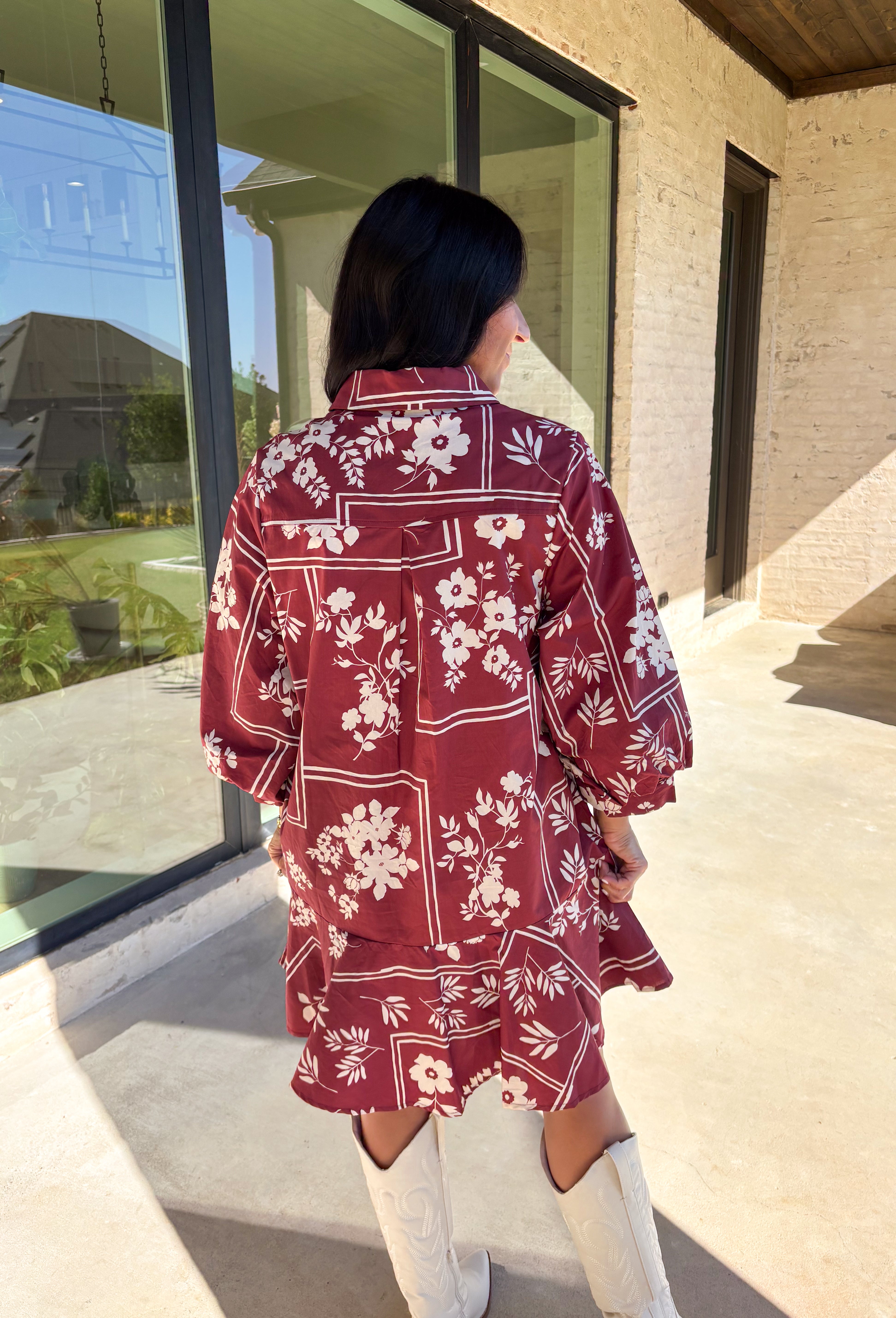 Effortless and feminine, this brick red dress is blooming with white botanical florals for a timeless autumn look. Featuring ¾ sleeves and a button-front closure, it blends comfort with charm. Side pockets add a touch of practicality, while the ruffle-free silhouette keeps it simple and chic. Fully lined and made from breathable cotton, this is the kind of dress you’ll love to style for everyday wear or seasonal gatherings.