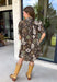 Warm autumn shades make this floral dress from Entro an easy pick for all your fall plans. The rich brown background is paired with a neutral floral print, creating a seasonal look that works beautifully for family photos, brunch, church, and weekend gatherings. A classic shirt collar and button-front closure give it a put-together feel, while short puff sleeves add just the right amount of shape. Pleated detailing at the back brings an unexpected touch to the silhouette.