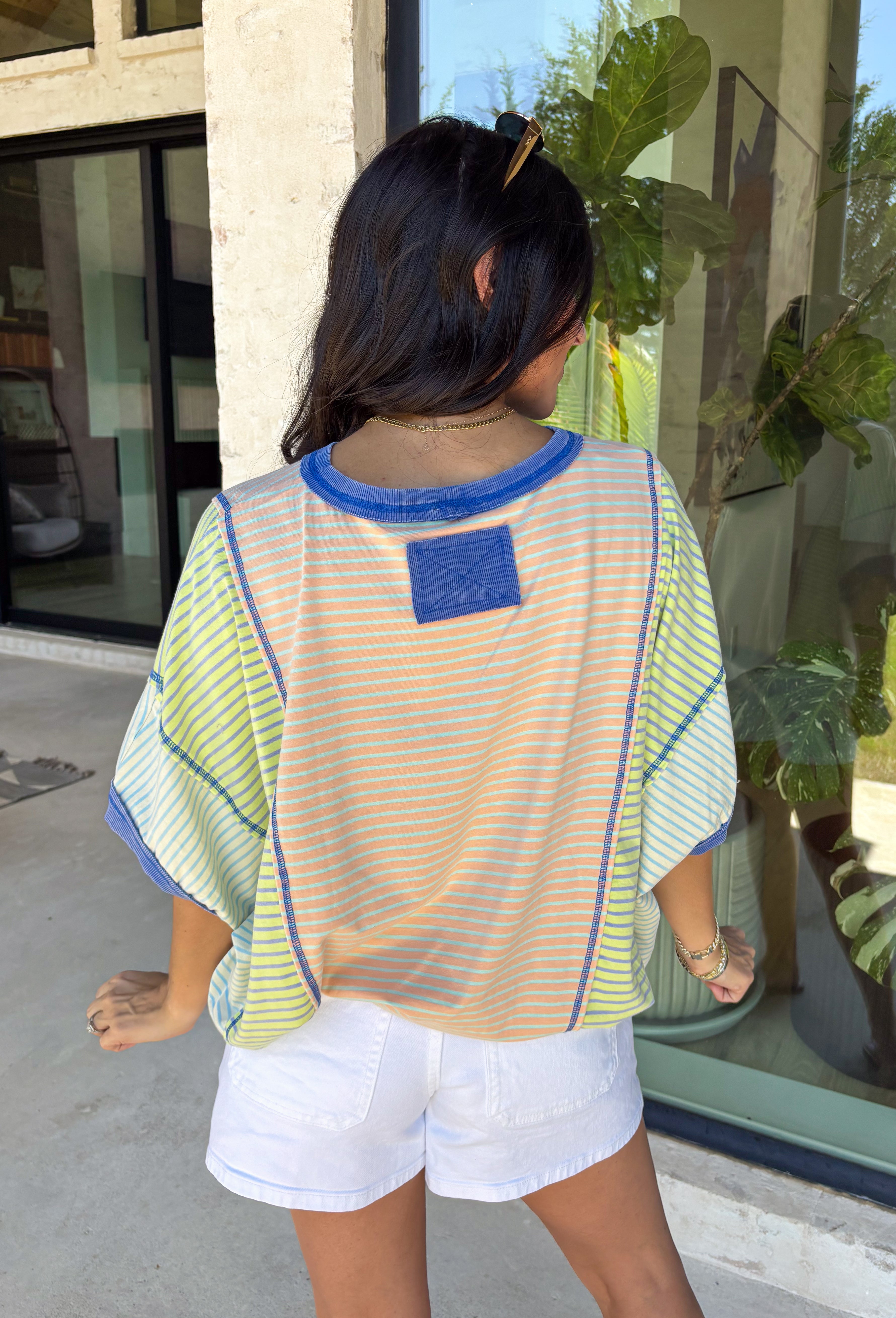 This color block stripe top is the perfect mix of laid-back and fun for summer! With shades of coral, tan, green, and blue, it brings a fresh pop of color while still feeling easy to style. The dark blue threading throughout adds a subtle contrast that pulls everything together, and the dolman sleeves give it that relaxed, effortless fit. Soft, stretchy, and breathable, it’s perfect for busy days when you want to feel comfortable but still put together. 
