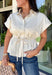 A timeless neutral top is one of the best investments for your fall wardrobe! This off white cotton blouse combines classic details with a flattering silhouette you'll love wearing on repeat. The collared neckline and button front create a polished look, while the elastic drawstring waist cinches just right for a feminine shape. Finished with a peplum hem and cap sleeves, it's the perfect blend of comfortable and elevated. 
