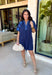 This short sleeve navy dress is such a pretty, easy pick for spring days when you want something simple but still special! The shades of blue embroidery along the neckline and sleeves add the perfect pop of detail, giving it a fresh, elevated look without feeling too dressy. Puff sleeves bring a feminine touch, while the relaxed fit keeps it comfortable enough for all-day wear.