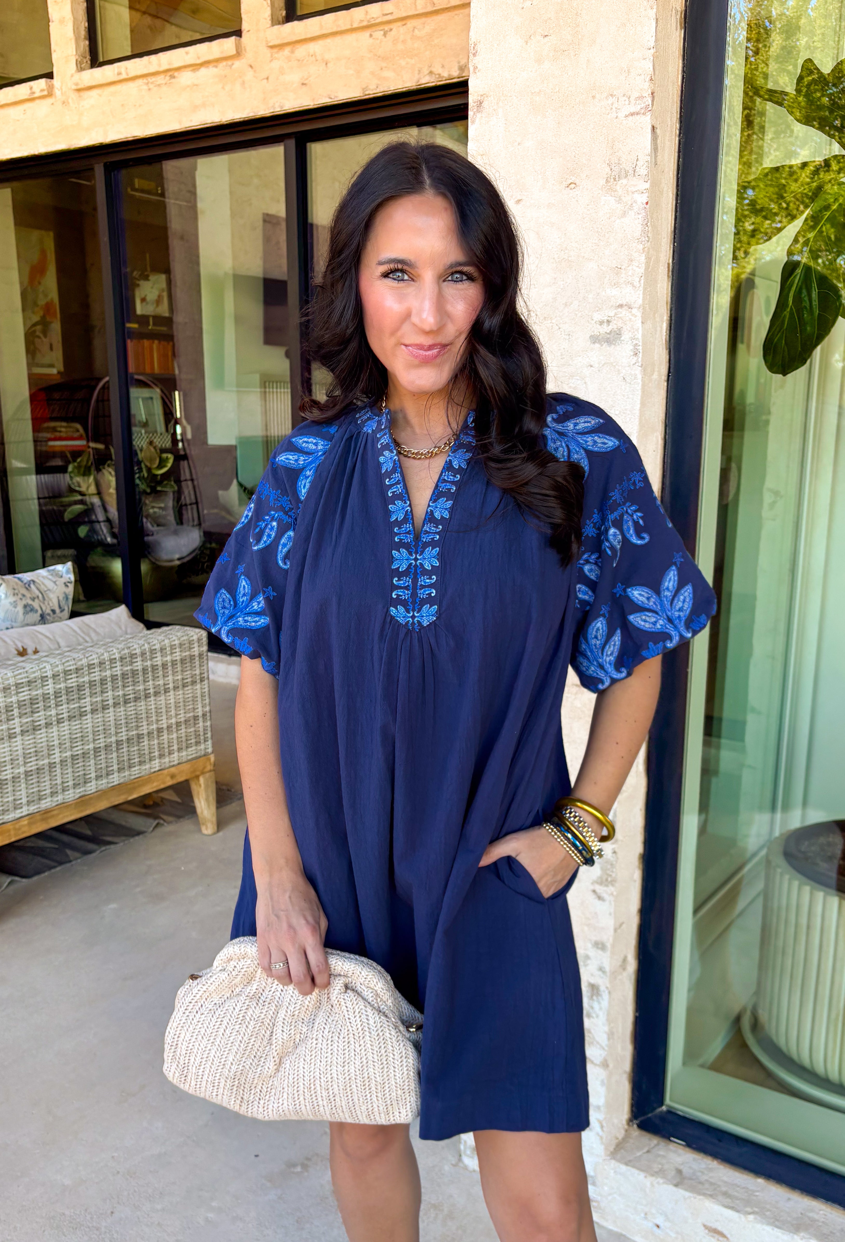 This short sleeve navy dress is such a pretty, easy pick for spring days when you want something simple but still special! The shades of blue embroidery along the neckline and sleeves add the perfect pop of detail, giving it a fresh, elevated look without feeling too dressy. Puff sleeves bring a feminine touch, while the relaxed fit keeps it comfortable enough for all-day wear.