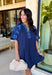 This short sleeve navy dress is such a pretty, easy pick for spring days when you want something simple but still special! The shades of blue embroidery along the neckline and sleeves add the perfect pop of detail, giving it a fresh, elevated look without feeling too dressy. Puff sleeves bring a feminine touch, while the relaxed fit keeps it comfortable enough for all-day wear.