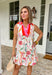 This off white sleeveless dress is basically spring in outfit form! The colorful floral print pops with shades of pink, blue, green, and orange, while the pink and tomato red contrasting trim along the collared neckline and front placket adds the sweetest statement detail. It’s bright, cheerful, and ready for all the sunshine-filled plans on your calendar. The tiered skirt gives it that easy, flowy movement we all love, and the lightweight fabric keeps it feeling breezy and comfortable all day long.