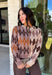 Classic patterns never go out of style, and this beautiful cardigan from THML is the perfect example. Designed with a timeless tan and brown argyle pattern, this cozy knit is finished with elegant gold buttons that add a polished touch. The neutral color palette makes it effortless to pair with everything in your wardrobe, while the ribbed neckline, cuffs, and hem create a refined finish. 