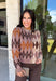 Classic patterns never go out of style, and this beautiful cardigan from THML is the perfect example. Designed with a timeless tan and brown argyle pattern, this cozy knit is finished with elegant gold buttons that add a polished touch. The neutral color palette makes it effortless to pair with everything in your wardrobe, while the ribbed neckline, cuffs, and hem create a refined finish. 