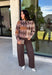 Classic patterns never go out of style, and this beautiful cardigan from THML is the perfect example. Designed with a timeless tan and brown argyle pattern, this cozy knit is finished with elegant gold buttons that add a polished touch. The neutral color palette makes it effortless to pair with everything in your wardrobe, while the ribbed neckline, cuffs, and hem create a refined finish. 
