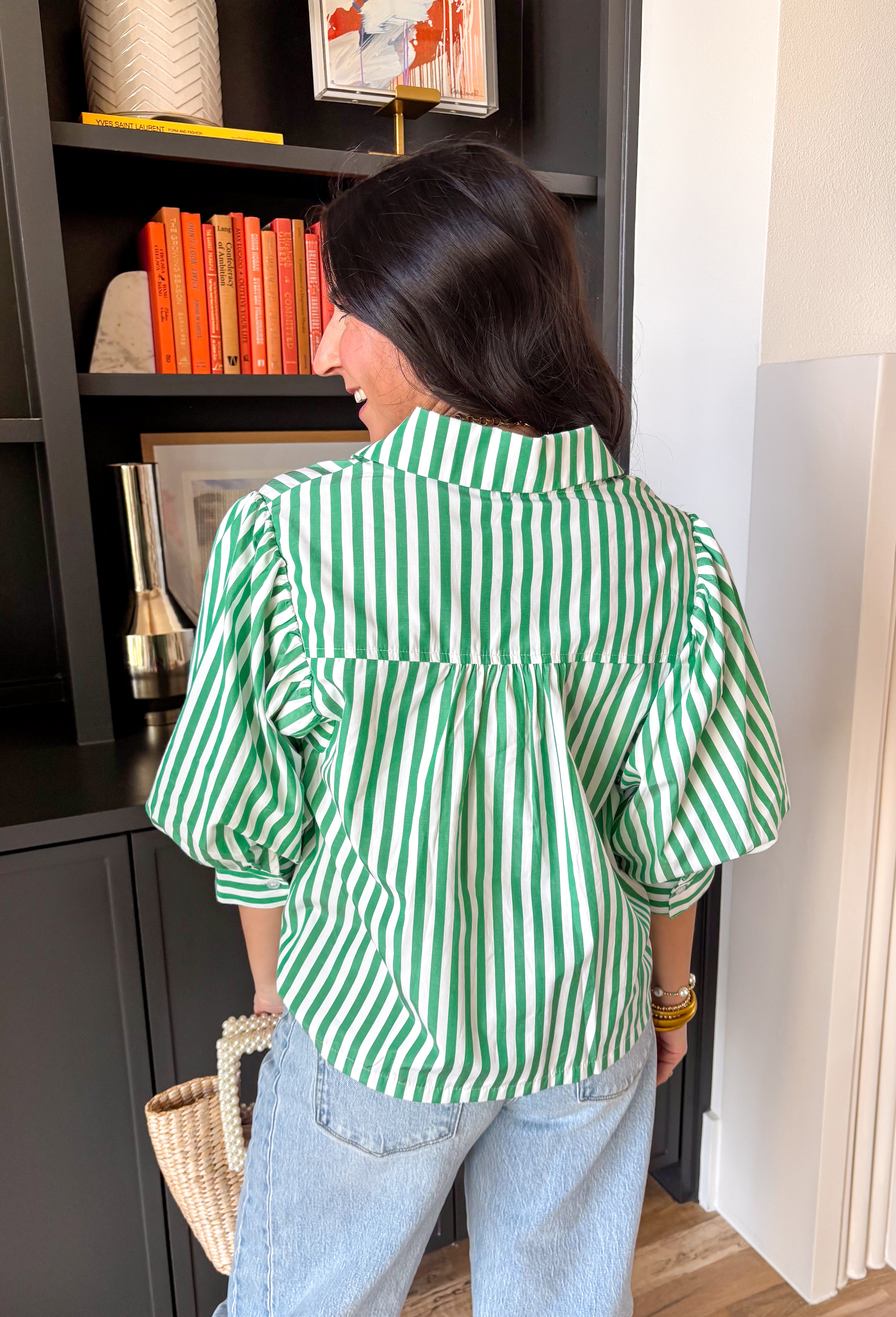 Meet your new spring go-to! This green and white striped button down top is the perfect mix of crisp and cute, with puff sleeves that add just the right amount of drama (the fun kind). The collared neckline keeps it polished, while the lightweight feel makes it easy to wear from morning errands to patio lunches. Pair it with your favorite denim and you’re instantly ready for all the fresh-air plans.