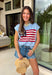 This light blue sweater top is the perfect way to celebrate summer in style! Featuring an American flag design on the front, it brings all the patriotic charm while still feeling classic and easy to wear. The lightweight knit construction makes it ideal for warm-weather celebrations, and the cap sleeves add a flattering, feminine touch. Whether you're heading to a backyard BBQ, a parade, a lake weekend, or fireworks with friends, this top is ready for all your 4th of July festivities. 