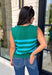 Classic stripes get a bold fall refresh with this cozy sleeveless sweater! Featuring a rich pine green knit with vibrant blue stripes, this sleeveless top is an easy way to add color to your seasonal wardrobe. Functional gold button closures along the sides add a unique, elevated touch, while the ribbed crew neckline and hem give it a timeless finish.