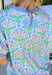 This short sleeve light blue top by Umgee is such a sweet and easy way to bring a little spring color into your everyday look. The floral print features soft pops of peach, white, and green for a fresh, pretty vibe that pairs perfectly with denim, white jeans, or even shorts once the weather warms up.The fabric has a light stretch that makes it easy to move in and super comfortable for all-day wear—whether you’re heading to work, running errands, or meeting friends for lunch. 