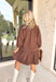 This brown textured dress is equal parts cozy and chic, making it a must-have for fall. Designed with a collared neckline and delicate ruffle trim, it brings a touch of femininity to its relaxed silhouette. The smocked balloon sleeves add volume and comfort, while the soft stretch fabric moves easily with you. Perfect for layering or styling on its own, this dress is ready to take you from weekday errands to weekend gatherings.