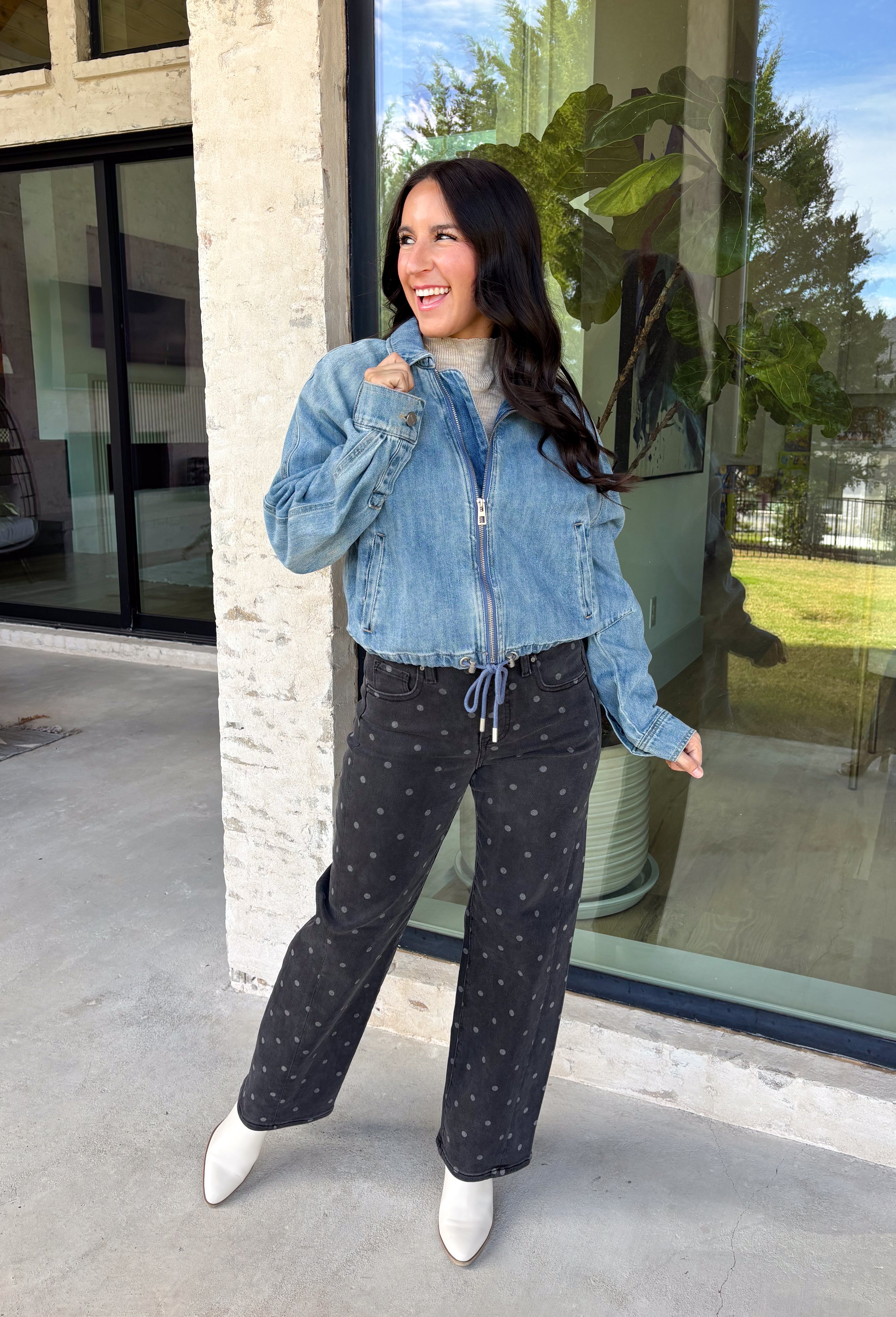 A classic denim layer gets a fresh update with this medium wash jacket from Risen. The timeless wash makes it easy to throw on with everything from fall dresses to cozy knits, while the front zipper closure gives it a more modern feel than your traditional button-front denim jacket. A collared neckline keeps the look classic, and button cuffs add a familiar denim detail at the sleeves. The adjustable toggle drawstring hem lets you customize the shape, while side pockets add everyday function.