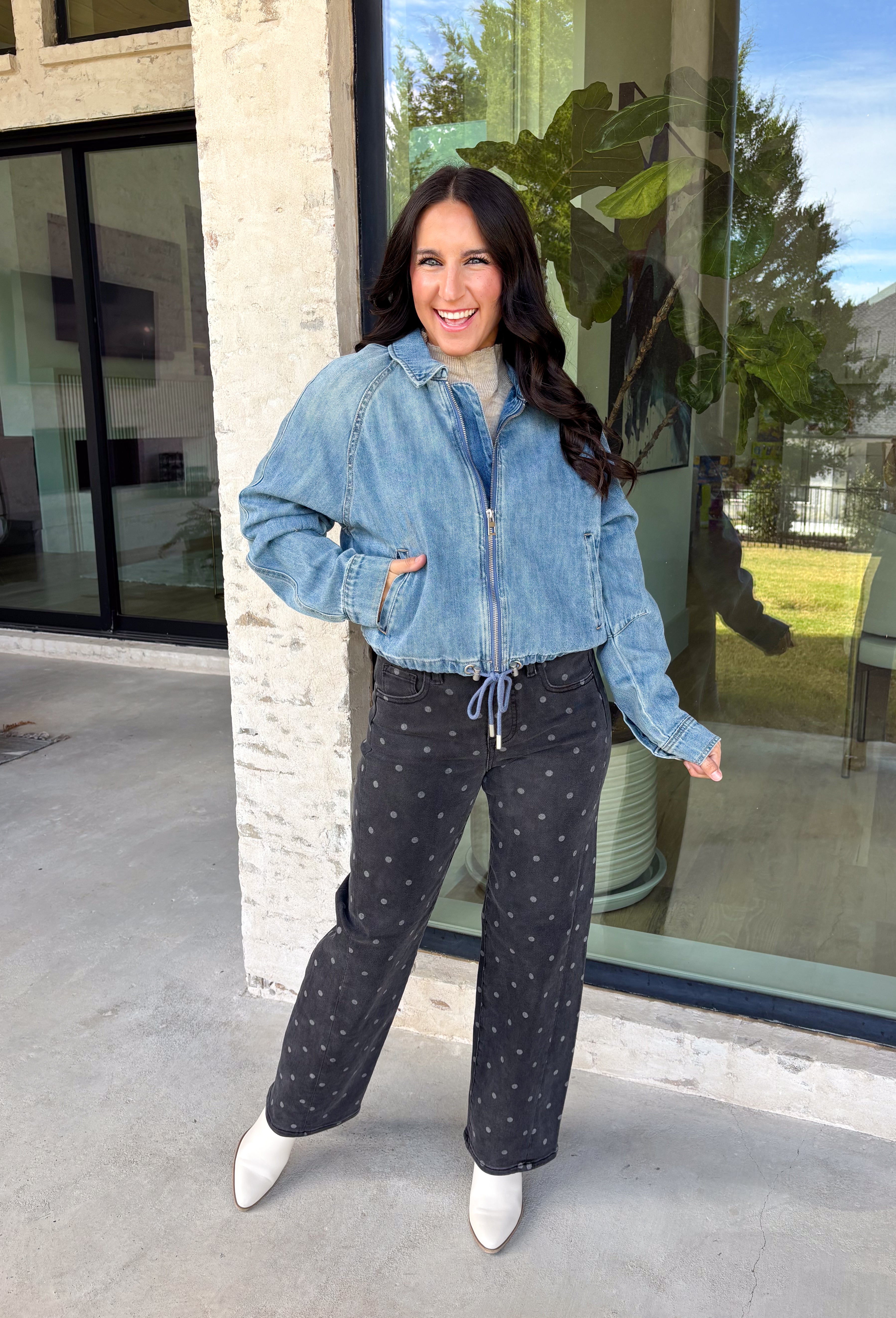 A classic denim layer gets a fresh update with this medium wash jacket from Risen. The timeless wash makes it easy to throw on with everything from fall dresses to cozy knits, while the front zipper closure gives it a more modern feel than your traditional button-front denim jacket. A collared neckline keeps the look classic, and button cuffs add a familiar denim detail at the sleeves. The adjustable toggle drawstring hem lets you customize the shape, while side pockets add everyday function.