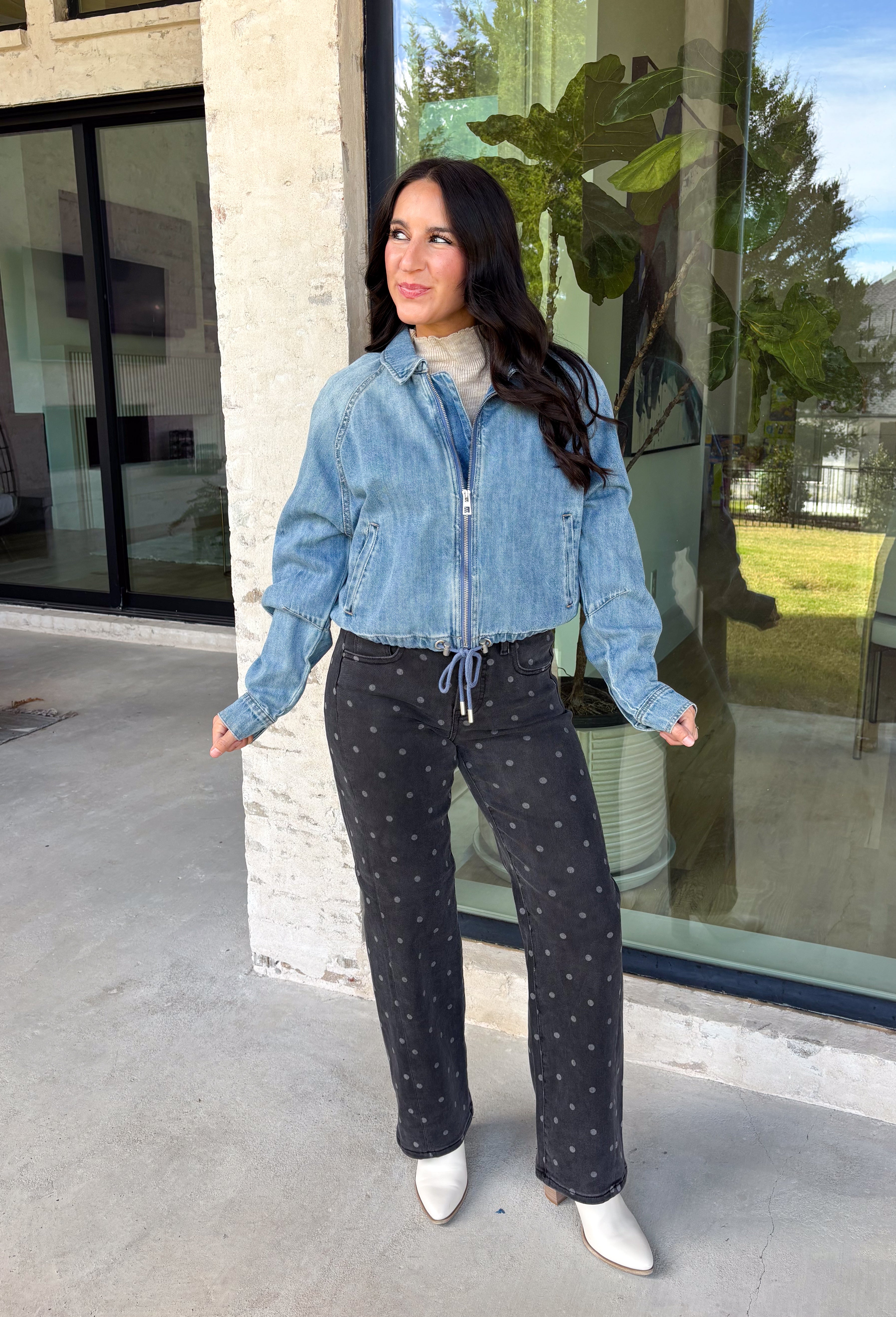 A classic denim layer gets a fresh update with this medium wash jacket from Risen. The timeless wash makes it easy to throw on with everything from fall dresses to cozy knits, while the front zipper closure gives it a more modern feel than your traditional button-front denim jacket. A collared neckline keeps the look classic, and button cuffs add a familiar denim detail at the sleeves. The adjustable toggle drawstring hem lets you customize the shape, while side pockets add everyday function.