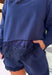 Cozy gets a pretty little upgrade with this navy sweatshirt from Sunday Edition. The classic long sleeve silhouette is finished with a lace hem, adding a feminine touch to an otherwise casual favorite. A soft fleece lining keeps it extra comfortable as chilly fall days start turning into winter weather. Pair it with the matching shorts for a cute coordinated set that’s perfect for relaxing, traveling, or casual weekend plans, or mix it into your closet with denim for an easy everyday outfit. 