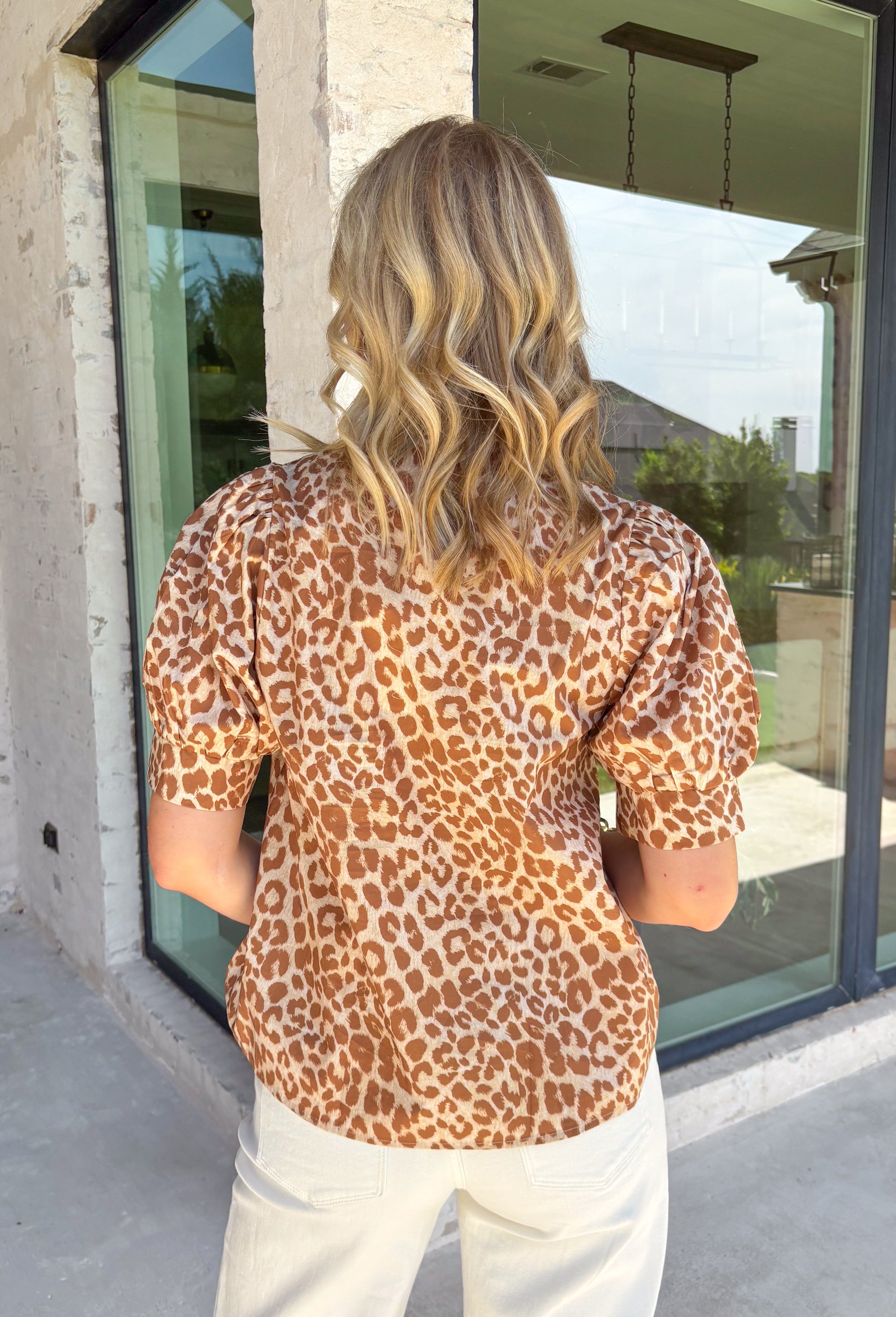 A timeless leopard print gets a fresh fall update in this effortlessly chic top! Featuring a classic leopard print with beautiful yellow embroidered detailing along the ruffle neckline, this top adds the perfect pop of color to your autumn wardrobe. The short puff sleeves create a feminine silhouette, while the breathable cotton fabric keeps it comfortable enough for all-day wear. 