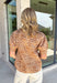 A timeless leopard print gets a fresh fall update in this effortlessly chic top! Featuring a classic leopard print with beautiful yellow embroidered detailing along the ruffle neckline, this top adds the perfect pop of color to your autumn wardrobe. The short puff sleeves create a feminine silhouette, while the breathable cotton fabric keeps it comfortable enough for all-day wear. 