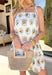 Bright, breezy, and full of spring charm, this sleeveless white dress is a total warm-weather favorite. The front features a gorgeous colorful embroidered print in shades of pink, green, yellow, blue, and brown, while the back stays solid white for a clean, classic contrast. Adjustable self-tie straps let you customize the fit, and the scalloped hem adds the sweetest finishing touch. 