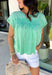 This green short sleeve top is the kind of easy, go-to piece you’ll reach for all summer long! The smocking detail across the front adds just the right amount of texture while creating a flattering, comfortable fit. Made from breathable 100% cotton, it’s lightweight and perfect for staying cool on warm days. It’s simple, versatile, and effortlessly put together—exactly what you want for busy days on the go. Pair it with denim shorts, white jeans, or a skirt for an easy everyday look. 