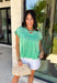 This green short sleeve top is the kind of easy, go-to piece you’ll reach for all summer long! The smocking detail across the front adds just the right amount of texture while creating a flattering, comfortable fit. Made from breathable 100% cotton, it’s lightweight and perfect for staying cool on warm days. It’s simple, versatile, and effortlessly put together—exactly what you want for busy days on the go. Pair it with denim shorts, white jeans, or a skirt for an easy everyday look. 