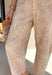 Bring a fresh twist to your fall wardrobe with these statement-making barrel jeans inspired by the beauty of the season! Designed in a warm tan hue with a subtle cream speckled fawn-inspired print, these jeans are the perfect blend of playful and polished. The on-trend barrel leg silhouette creates an effortlessly relaxed look while still feeling elevated enough for brunch dates, pumpkin patch adventures, and weekend shopping trips. 