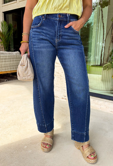 Relaxed, cool, and effortlessly on-trend! These dark wash slouchy crop barrel jeans by Risen bring the perfect mix of comfort and style. The slouchy fit and cropped length give them that laid-back, modern feel, while the rich dark wash keeps them easy to dress up or down. Designed with added stretch for all-day comfort, these jeans move with you while maintaining their shape. The barrel silhouette adds a fun, fashion-forward touch that makes them a standout piece in your everyday rotation.