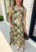 Classic plaid meets soft florals in this charming midi dress that's made for all your favorite fall occasions! Featuring an olive plaid backdrop with a neutral floral print, this cotton dress offers a unique blend of timeless patterns that feels effortlessly seasonal. The flattering v-neckline and sleeveless silhouette make it easy to wear on its own during warmer days or layered under a cardigan or denim jacket as the temperatures cool. 