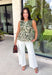 Feminine, flattering, and effortlessly versatile, this peplum top from Entro is a beautiful addition to your fall wardrobe. Designed in a rich olive hue with a soft cream floral print, this timeless top brings the perfect balance of classic style and seasonal charm. The round neckline creates a polished look, while the peplum silhouette offers a flattering, feminine shape.