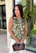 Feminine, flattering, and effortlessly versatile, this peplum top from Entro is a beautiful addition to your fall wardrobe. Designed in a rich olive hue with a soft cream floral print, this timeless top brings the perfect balance of classic style and seasonal charm. The round neckline creates a polished look, while the peplum silhouette offers a flattering, feminine shape.
