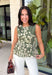 Feminine, flattering, and effortlessly versatile, this peplum top from Entro is a beautiful addition to your fall wardrobe. Designed in a rich olive hue with a soft cream floral print, this timeless top brings the perfect balance of classic style and seasonal charm. The round neckline creates a polished look, while the peplum silhouette offers a flattering, feminine shape.