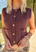 Layering just got cozier with this brown sweater knit vest top. Designed with gold accent buttons down the front and functional front pockets, it’s the perfect mix of polish and comfort. The soft knit blend makes it warm yet breathable, ideal for styling over long sleeve tops, blouses, or dresses as the season changes. From casual coffee runs to days at the office, this vest is a versatile fall layer you’ll reach for again and again.
