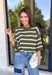 Fresh stripes and easy fall colors come together in this short sleeve sweater from Entro. The olive base is accented with off white and light blue stripes for a color combination that feels a little unexpected while still being easy to style. Made from 100% cotton, the knit has a comfortable feel that works especially well during those in-between fall days when it’s not quite cool enough for heavy layers. 