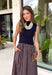 Classic style meets modern charm in this beautifully crafted midi dress from Entro. Designed with a navy sleeveless knit bodice, this effortlessly polished dress features a mock neckline for an elevated touch. The standout contrast skirt showcases navy and brown stripes that add beautiful movement and seasonal style. Finished with convenient side pockets and a fully lined skirt, this versatile midi dress is perfect for everything from workdays to brunch dates and special fall gatherings.