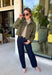 Make a statement everywhere you go with this stunning denim jacket from Veveret. Crafted in a rich olive denim, this standout layer features a breathtaking sheer embroidered floral design across the back, accented with shimmering sequins in shades of green, pink, orange, and brown. Coordinating floral sequin details on the front pockets tie the look together beautifully, while the classic collared neckline and button-front design keep it timeless. 